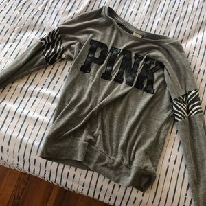 Two Victoria secret shirts and an American eagle.